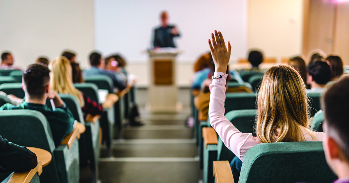 student_raising_hand_lecture_hall